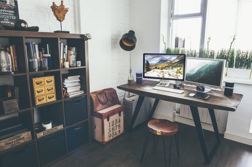 Chosen photo for surrounding yourself with people who get it. A structured office setting, authentic look with desk, bookshelf, light and stool - wood.